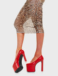 PARTY ALL NIGHT 
  
  Baddy Platform Heels Red Pat in Red patent. These platform boots feature a minimalist look with a heart shaped high heel, keeping it nice and classy.These heels also feature a pink heart on the heel. Made with eco-friendly materials and 100% cruelty-free, these platform boots are as ethical as they are chic.
  
  - Platform Height
  - Heart shaped heel
  - Silver Buckle
  - Silver Eyelets
  - High heel
  - Round toe
  - High Heel
  - 100% vegan
  
  SKU: LMF 4623 - RedPAT