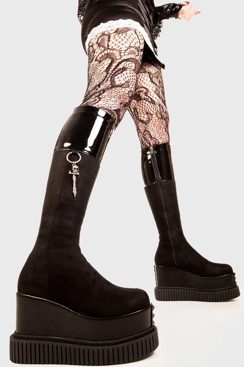 Sneaky Soles
  
  Devious Chunky Platform Knee High Boots in Black Faux leather. These black vegan Platform Boots feature two designer zips on the outter and towards the inner of the boot, leaving lasting impressions. Made with eco-friendly materials and 100% cruelty-free, these platform boots are as ethical as they are DEVIOUS!
  
  - Platform Height: 3 inch
  - Silver zipper 
  - Chunky platform sole
  - Round Toe
  - 100% vegan 
  
  SKU: LMF 1886 - BlackPU