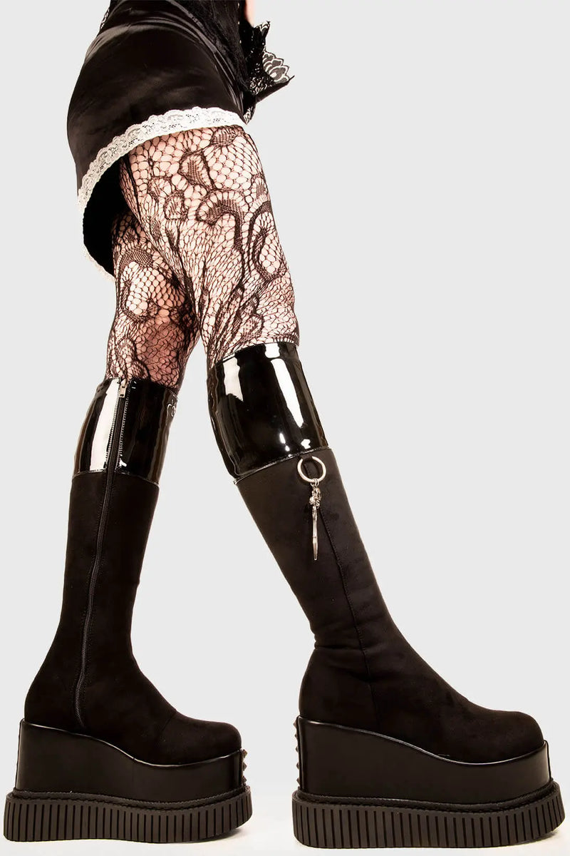 Sneaky Soles
  
  Devious Chunky Platform Knee High Boots in Black Faux leather. These black vegan Platform Boots feature two designer zips on the outter and towards the inner of the boot, leaving lasting impressions. Made with eco-friendly materials and 100% cruelty-free, these platform boots are as ethical as they are DEVIOUS!
  
  - Platform Height: 3 inch
  - Silver zipper 
  - Chunky platform sole
  - Round Toe
  - 100% vegan 
  
  SKU: LMF 1886 - BlackPU