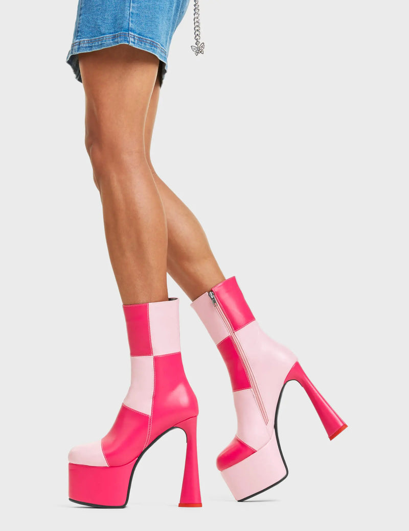 NEVER FOLD 
  
  Fuchsia City Platform Ankle Boots in Pink and Fuchsia faux leather. These platform boots featurex our patch work look design with a Heart shaped heel that included a red heart at the bottom, keeping it nice and classy. Made with eco-friendly materials and 100% cruelty-free, these platform boots are as ethical as they are chic.
  
  - Platform Height: 6 CM
  - Heel Height: 14 CM
  - Ankle length
  - Lace up
  - Heart heel
  - High Heel
  - 100% vegan
  
  SKU: LMF 4470 - PinkPU/FuchsiaPU