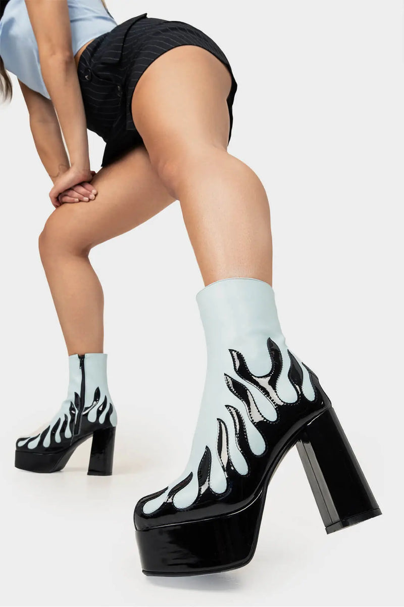 Power Up.
  
  High Voltage Platform Ankle Boots in Blue. These vegan Platform Boots feature a patent black flame sole and heel, charging up your shoe game. Made with eco-friendly materials and 100% cruelty-free, these Boots are as ethical as they are shockingly stylish!
  
  - Platform Height: 1.25 inch
  - Heel Height: 4.2 inch
  - Patent Black flame
  - Black Zipper
  - Platform sole
  - Round toe
  - 100% vegan
  
  SKU: LMF 1566 - BluePU