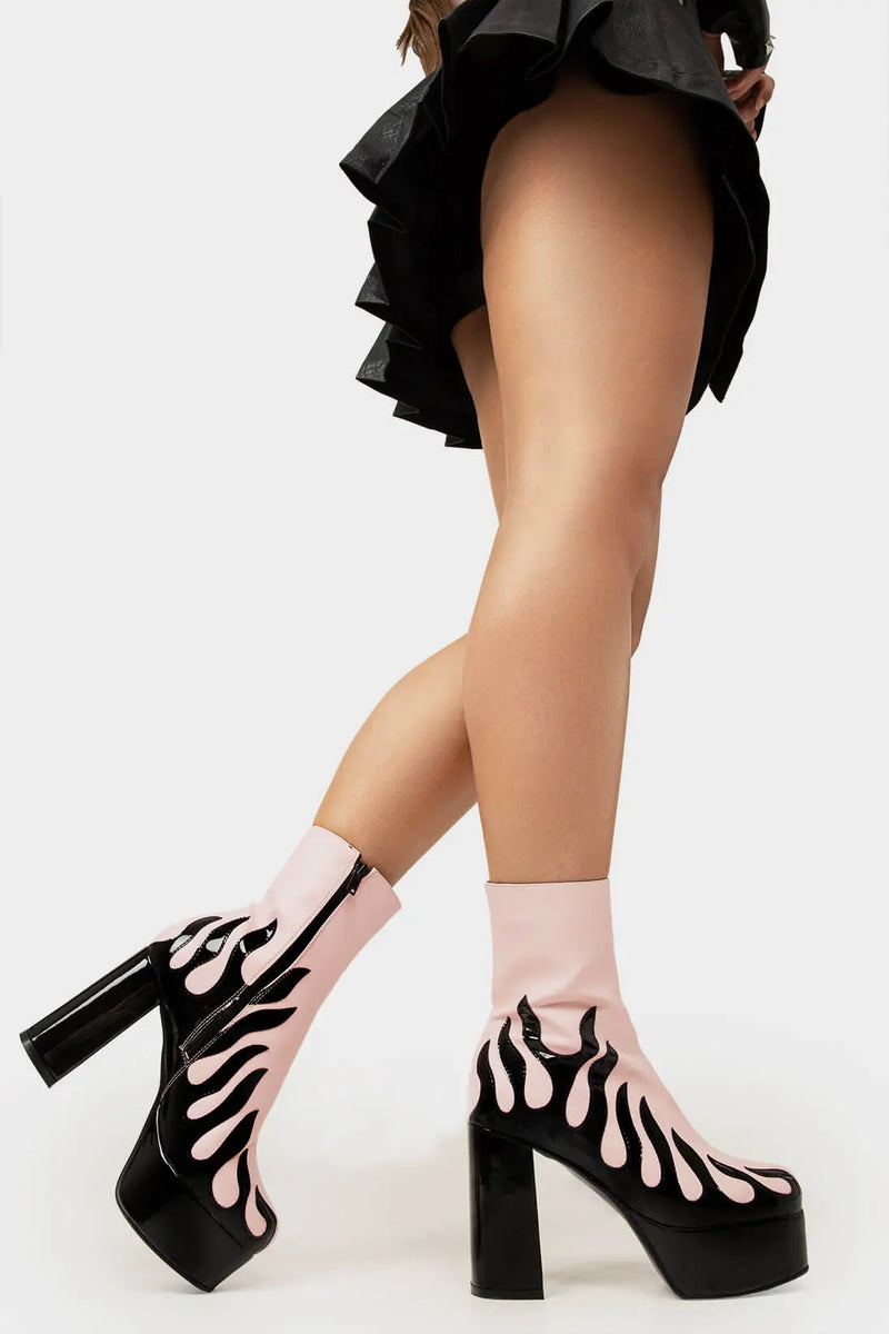Power Up.
  
  High Voltage Platform Ankle Boots in Pink. These vegan Platform Boots feature a patent black flame sole and heel, charging up your shoe game. Made with eco-friendly materials and 100% cruelty-free, these Boots are as ethical as they are shockingly stylish!
  
  - Platform Height: 1.25 inch
  - Heel Height: 4.2 inch
  - Patent Black flame
  - Black Zipper
  - Platform sole
  - Round toe
  - 100% vegan
  
  SKU: LMF 1566 - PinkPU