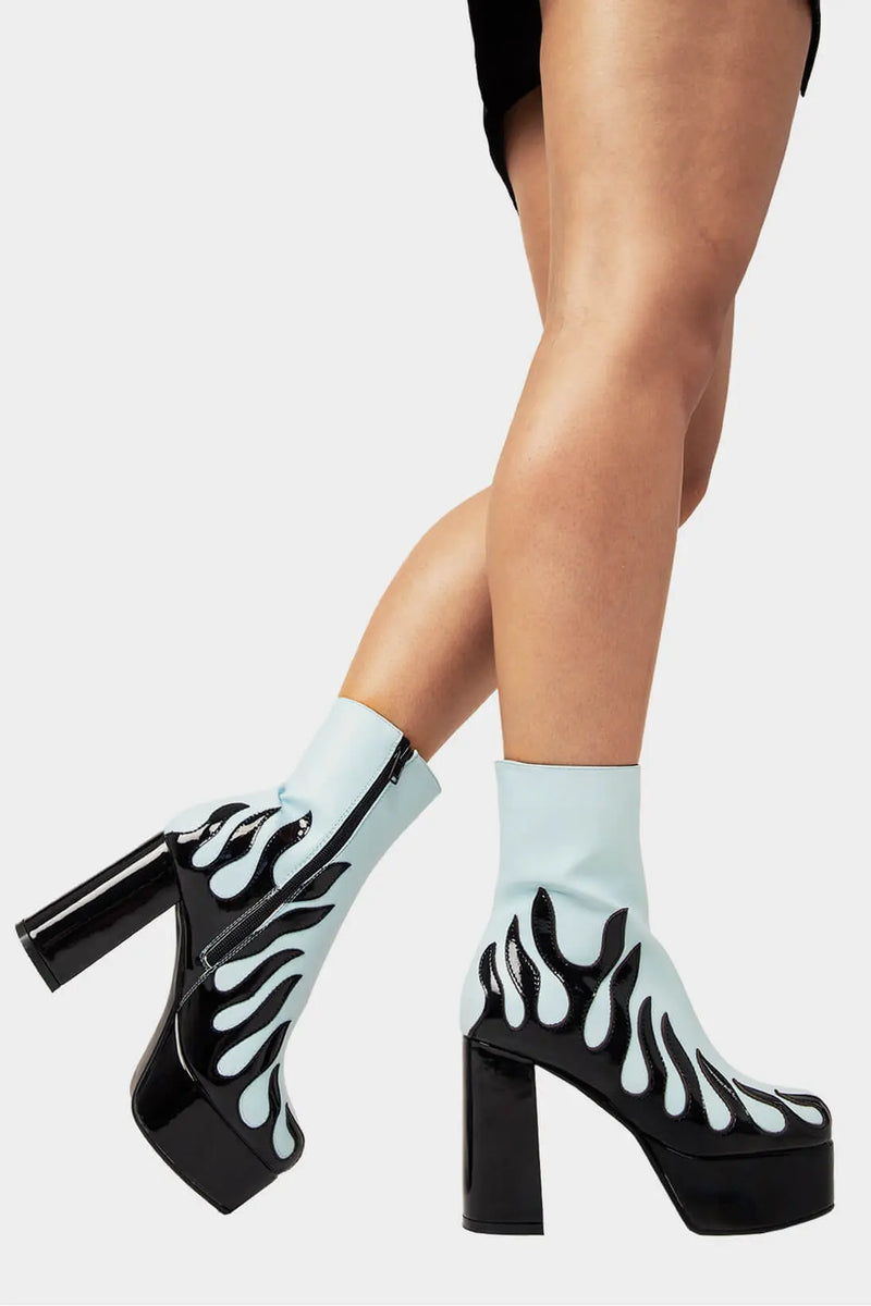Power Up.
  
  High Voltage Platform Ankle Boots in Blue. These vegan Platform Boots feature a patent black flame sole and heel, charging up your shoe game. Made with eco-friendly materials and 100% cruelty-free, these Boots are as ethical as they are shockingly stylish!
  
  - Platform Height: 1.25 inch
  - Heel Height: 4.2 inch
  - Patent Black flame
  - Black Zipper
  - Platform sole
  - Round toe
  - 100% vegan
  
  SKU: LMF 1566 - BluePU