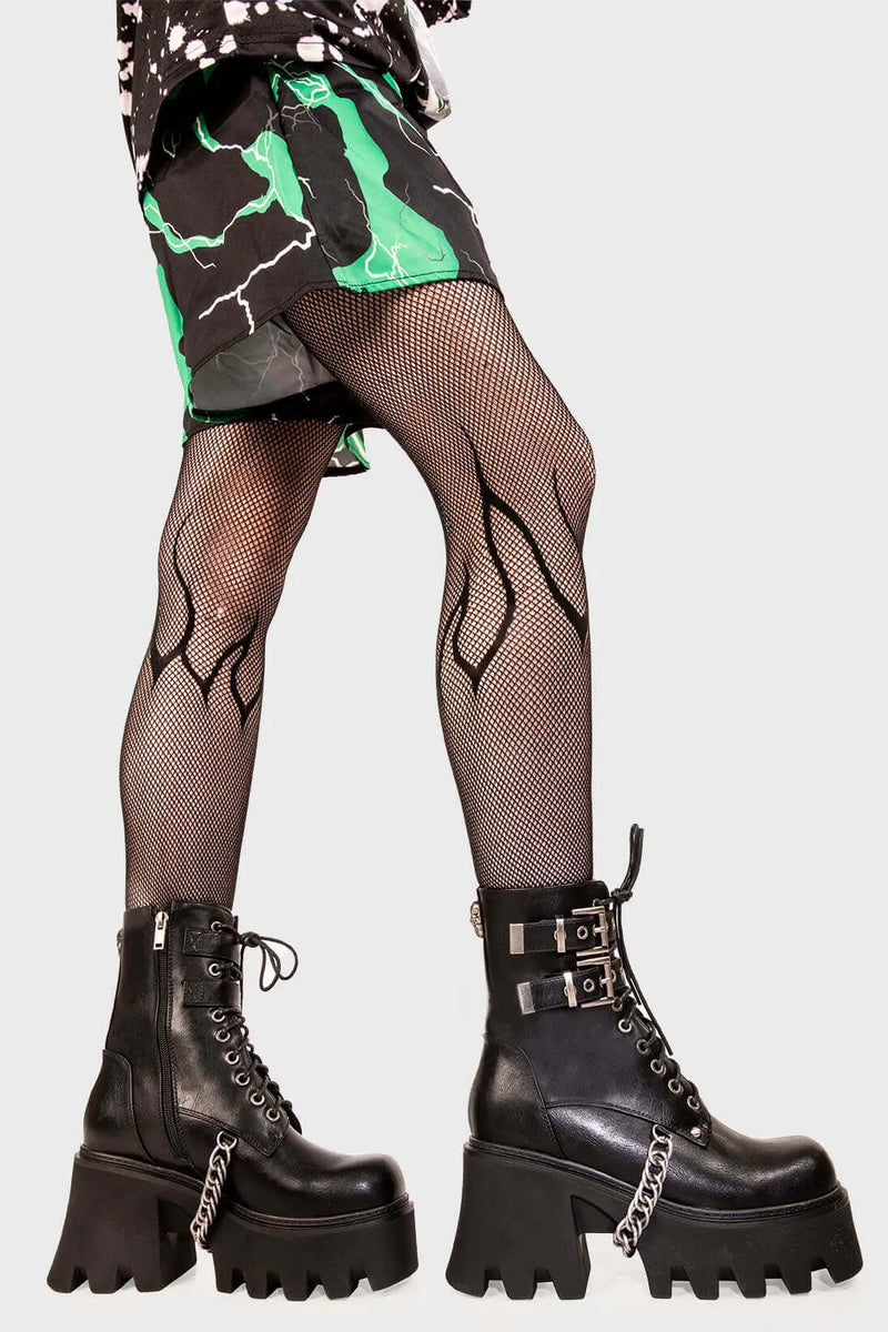 Break Free
  
  Hostages Chunky Platform Ankle Boots in black faux leather. These black vegan Platform Boots feature lace up detail with silver eyelets and two black adjustable straps with square shaped buckles, the perfect fit for your style. Made with eco-friendly materials and 100% cruelty-free.
  
  
  - Platform Height: 3.3 inch
  - Black zipper
  - Lace up detail with silver eyelets
  - Black straps square shaped buckles 
  - Chunky platform sole
  - Round Toe
  - 100% vegan