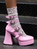 Stellar Stompers
  
  Interstellar Platform Heels in Pink Patent faux leather. These vegan Platform Heels feature four adjustable pink patent ankle straps with ""O"" ring buckles and silver eyelets on a platform sole, stepping into stellar universe. 
  
  - Platform Height: 2.6 inch
  - Heel Height: 5.5 inch
  - Four adjustable pink patent strap
  - Silver eyelets 
  - ""O"" ring buckles
  - Platform sole
  - Flared heel
  - Round toe
  - 100% vegan
  
  SKU: LMF 1704 - PinkPAT
