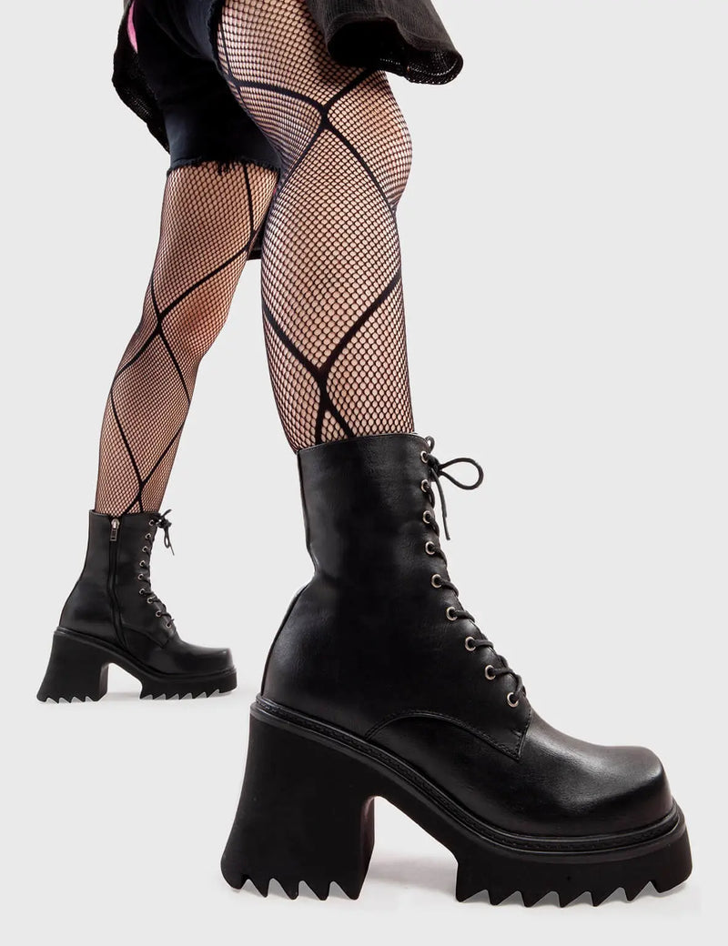 Anything But Basic
  
  Just You Chunky Platform Ankle Boots in Black faux leather. These platform boots feature an elegant, minimalist design, with laces and a chunky sole, the perfect way to elevate any outfit. Made with eco-friendly materials and 100% cruelty-free, these platform boots are as ethical as they are cool.
  
  - Platform Height
  - Heel Height 
  - Lace-up with silver eyelets
  - Black Zip
  - Shark's teeth grip
  - Chunky Platform sole
  - 100% vegan 
  
  SKU: LMF 2912 - BlackPU