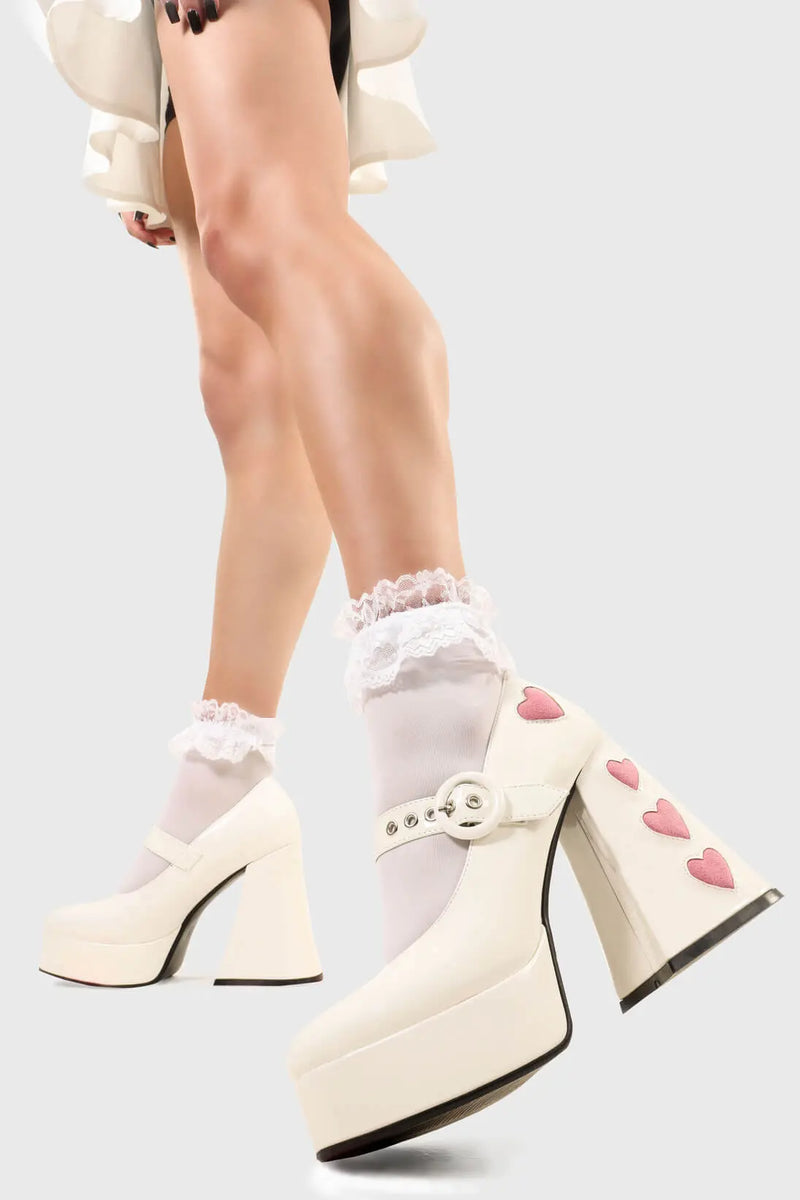 Cupid is here 
  
  Love Sick Platform Heels in Black Patent faux leather. These vegan Platform Heels feature pink patent hearts on the heel and side of the shoe with a adjustable black strap, Heels that speak the language of love. 
  
  - Platform Height: 2.6 inch
  - Heel Height: 5.5 inch
  - Ajustable strap 
  - "O" ring shaped buckles and silver eyelets
  - Pink Patent hearts 
  - Platform sole
  - Flared heel
  - Round toe 
  - 100% vegan
  
  SKU: LMF 1709 - WhitePAT/PinkHeart