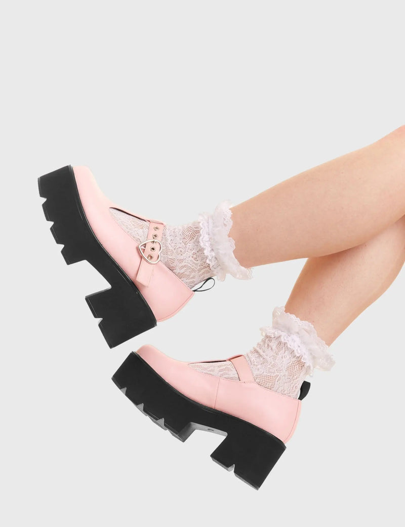 SIMPLY IN LOVE 
  
  Love Story Chunky Mary Jane Shoes in Pink faux leather. These vegan western Boots feature a minimalist design with an adjustable heart buckled straps, very cute. Made with eco-friendly materials and 100% cruelty-free, these boots are as ethical as they are romantic!
  
  
  - Platformed
  - Ankle length
  - Silver heart buckle
  - Chunky black sole
  - Rounded toe 
  - 100% vegan 
  
  SKU: LMF 3901 - PinkPU