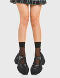 SIMPLY IN LOVE 
  
  Love Story Chunky Mary Jane Shoes in Black faux leather. These vegan western Boots feature a minimalist design with an adjustable heart buckled straps, very cute. Made with eco-friendly materials and 100% cruelty-free, these boots are as ethical as they are romantic!
  
  
  - Platformed
  - Ankle length
  - Silver heart buckle
  - Chunky black sole
  - Rounded toe 
  - 100% vegan 
  
  SKU: LMF 3901 - BlackPU