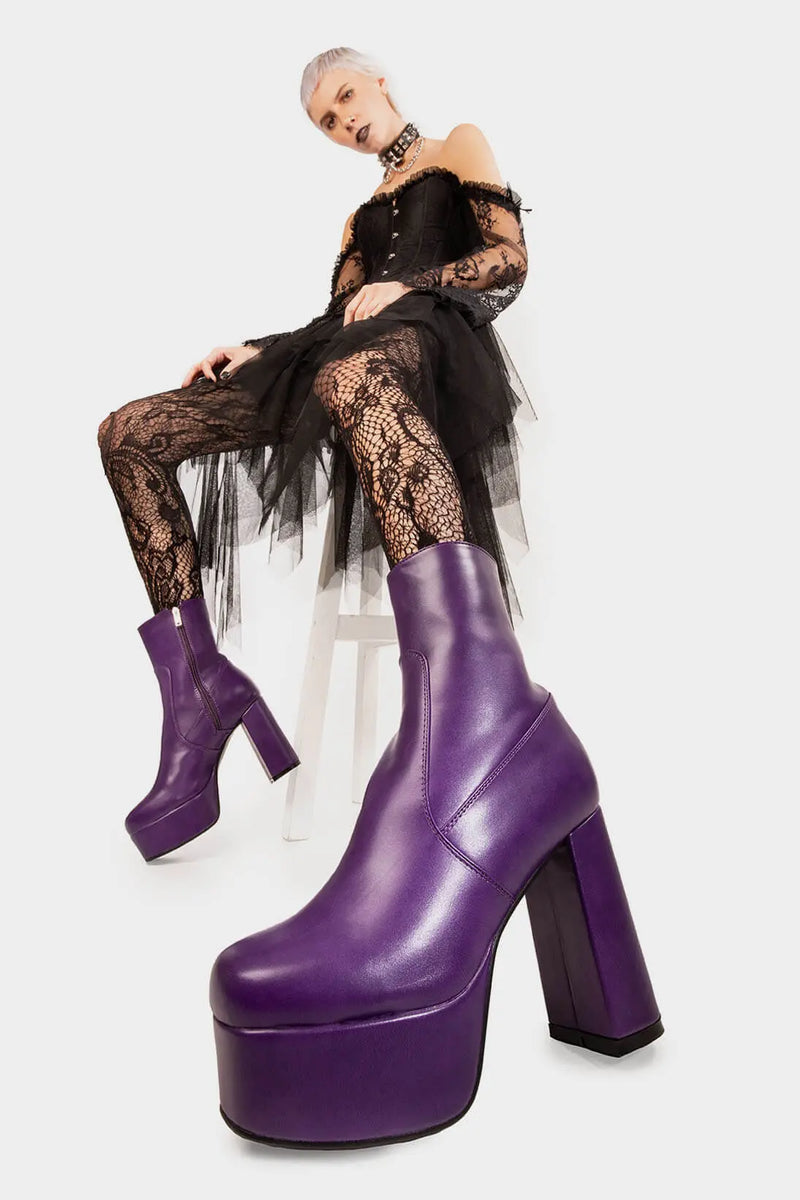 Diva's Delight.
  
  Making Moves Platform Ankle Boots in Purple faux leather. These vegan Platform Ankle boots feature a platform sole to reach new heights in the style game. Made with eco-friendly materials and 100% cruelty-free, these Boots are as ethical as they are delightful!
  
  - Platform Height: 1.25 inch
  - Heel Height: 4.2 inch
  - Purple Zipper
  - High Platform sole
  - Round toe
  - 100% vegan
  
  SKU: LMF 1559 - PurplePU