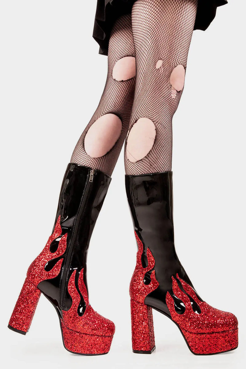 Flame Fury
  
  Miami Platform Calf Boots Boot in Patent Black faux leather. These black vegan Platform Boots feature red glitter flame detail up the sole, flames of style to ingnite your presencel! Made with eco-friendly materials and 100% cruelty-free, these platform boots are as ethical as they are HOT!
  
  
  - Platform Height
  - Heel Height 
  - Black zip
  - Platform Sole 
  - Round Toe
  - 100% vegan 
  
  SKU: LMF 2039 - BlackPAT/RedGlitter