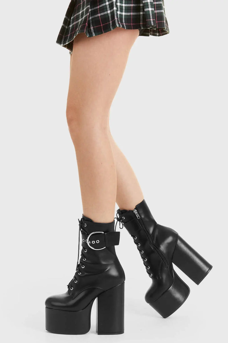 Not Your Basic Boots

One Shot Platform Ankle Boots in Black faux leather. These platform boots feature a lace-up design, with a thick strap around the angle with a silver buckle, perfect to elevate any outfit. Made with eco-friendly materials and 100% cruelty-free, these platform boots are as ethical as they are Perfect!

- Platform Height
- Heel Height
- Black Zipper
- lace-up
- Strap around ankle
- silver buckle and eyelets
- Ankle length
- Platform sole
- High Heel
- 100% vegan 

SKU: LMF 2848 - BlackPU