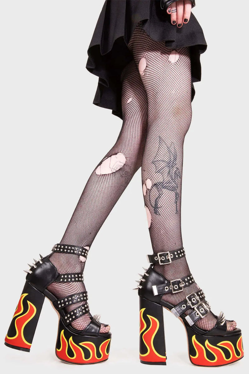 IT'S ALL IN THE DETAILS!
 
 Revin' Plaform Sandals in Black faux leather. These vegan Platform Sandals feature a flame print, silves spikes with a Platform sole and high heel, perfect for adding height and glamour to any outfit. Made with eco-friendly materials and 100% cruelty-free, these Sandals are as ethical as they are badass!
 
 
 - Platform Height: 2.5 inch
 - Heel Height: 5.5 inch 
 - Open Toe
 - Flame print
 - Adjustable ankle straps
 - Silver spikes & studs
 - High Platform sole
 - Round toe