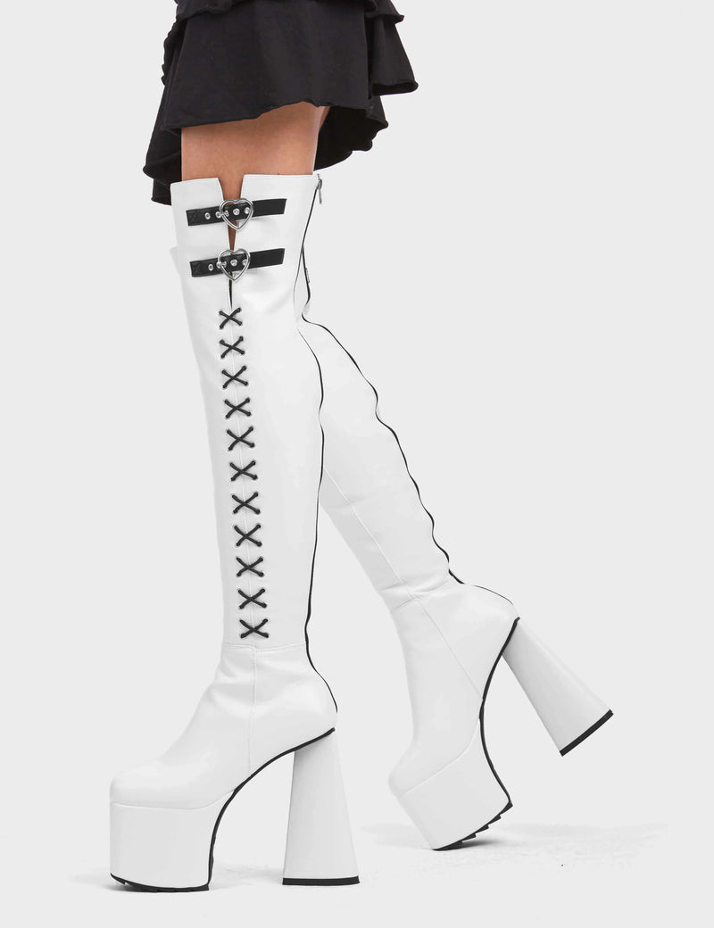 DONT STOP

Small Victories Platform Thigh High Boots in White faux leather. These platform boots feature a heart shaped heel and a black heart at the bottom. The boots also feature black lace detailing across the side of the boot. Also features two adjustable straps with silver eyelets and heart shaped buckles. 100% vegan 

- Platform Height
- Knee High Length
- Heart Heel
- Black Heart
- Silver Eyelets
- Heart Buckles
- Adjustable Straps
- Black Lace Detail
- 100% Vegan

SKU: LMF 4910 - WhitePU