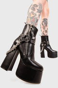 BIKER GAL

So What Platform Ankle Boots in Black faux leather. These Platform Boots feature removable saddle with silver studs and a haning chain, making them the perfect choice to elevate your look! Made with eco-friendly materials and 100% cruelty-free, these boots are as ethical as they are wild!


- Platform Height: 2.5 inch
- Heel Height: 5.5 inch 
- Mid ankle length 
- Silver zipper
- Removable saddle
- Silver chain and studs
- High Platform sole
- Round toe 
- 100% vegan 

SKU: LMF 0150 - BlackPU