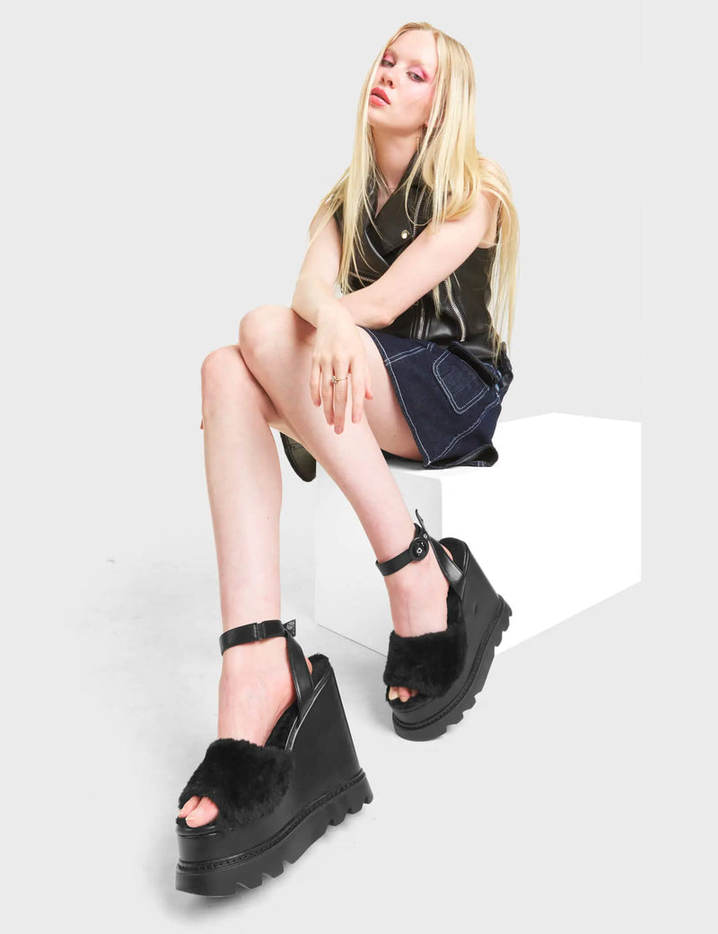 2 AM
  
  Softie Chunky Platform Sandals in Black faux leather. These sandals feature an adjustable ankle strap with silver eyelets and 'O' ring buckles. Proudly features a fur detail across the upper. Made with eco-friendly materials and 100% cruelty-free, these platform boots are as ethical as they are Charming.
  
  - Platform Height
  - Heel Height
  - Adjustable Black Strap
  - Silver Eyelets 
  - 'O' ring buckle
  - Chunky Platform Sole
  - Open Toe
  - 100% vegan
  
  SKU: LMF 4884 - BlackPU/FUR