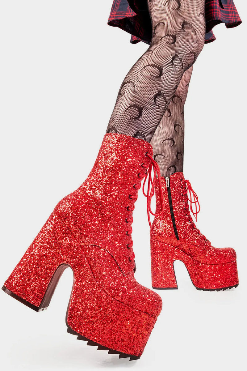 Dazzling Delights
 
Spotlight Chunky Platform Ankle Creeper Boot in Red Glitter. These red vegan Platform Boots feature our iconic glitter detail througout with adjustable lace up detail, shiny perfection to glow with every step. Made with eco-friendly materials and 100% cruelty-free.


- Platform Height: 2.3 inch
- Heel Height: 5.5 inch
- Black zipper 
- Red laces and silver eyelets 
- Chunky Creeper sole
- Round Toe
- 100% vegan 

SKU: LMF 2046 - RedGlitter