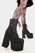 Dazzling Delights
 
Spotlight Chunky Platform Ankle Creeper Boot in Black Glitter. These black vegan Platform Boots feature our iconic glitter detail througout with adjustable lace up detail, shiny perfection to glow with every step. Made with eco-friendly materials and 100% cruelty-free.


- Platform Height: 2.3 inch
- Heel Height: 5.5 inch
- Black zipper 
- Black laces and silver eyelets 
- Chunky Creeper sole
- Round Toe
- 100% vegan 

SKU: LMF 2046 - BlackGlitter