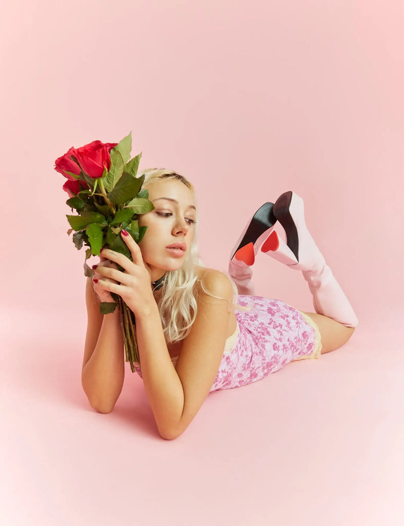 LOVEABLE 
  
  Sweet Talker Wide Calf Platform Knee High Boots in Pink faux leather. These platform boots feature a minimalist look with a heart shaped heel, keeping it nice and classy. Made with eco-friendly materials and 100% cruelty-free, these platform boots are as ethical as they are chic.
  
  - Platform Height
  - Knee length
  - Heart shaped heel
  - Red sole
  - Wide calf 
  - Pink zip
  - High Heel
  - 100% vegan 
  
  SKU: LMF 3313 - PinkPU - WIDE FIT