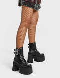 DREAMS
 
 Thinking Spot Chunky Platform Ankle Boots in black faux leather. These black vegan platform boots feature lace up design with a adjustable faux leather flap that includes silver eyelets and two adjustable straps alongside two square shaped buckles, On our rubber grip, chunky platform sole, these platform boots are as ethical as they are perfect!
 
 
 - Platform Height:
 - Black Zipper
 - Lace Up
 - Silver Eyelets
 - Silver Buckles
 - Chunky Platform Sole
 - 100% vegan
 
 SKU: LMF 4108 - BlackPU